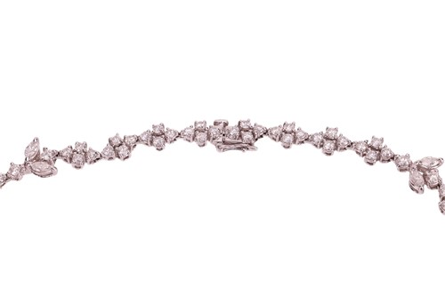 Lot A diamond-set necklace of abstract foliate...