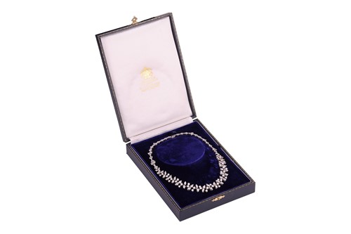 Lot A diamond-set necklace of abstract foliate...
