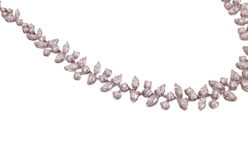 Lot A diamond-set necklace of abstract foliate...