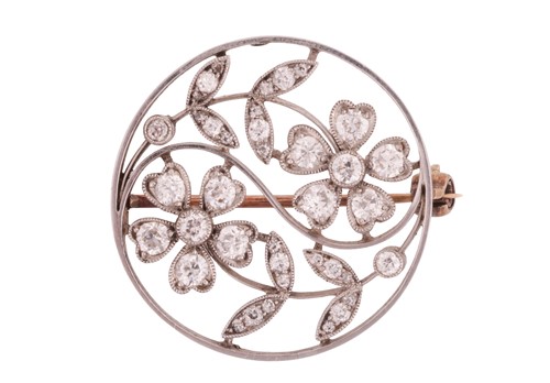 Lot An edwardian diamond brooch, the circular...