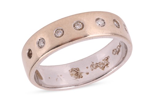 Lot 164 - A diamond-set band, comprising a flat-shaped...