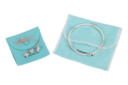 Lot 133 - Tiffany & Co - A Cross stitch pendant,...