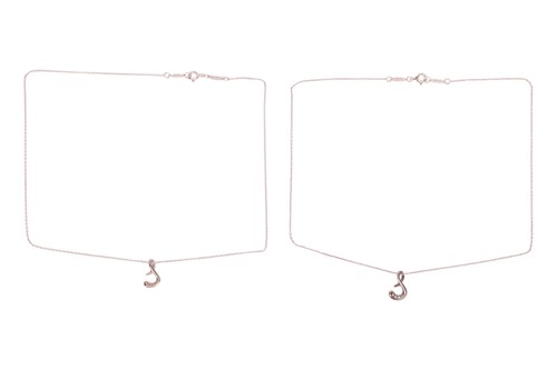 Lot 130 - Tiffany & Co - Two Elsa Peretti 'S' pendants...