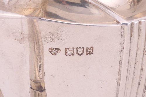 Lot A four piece silver tea service; comprising a...