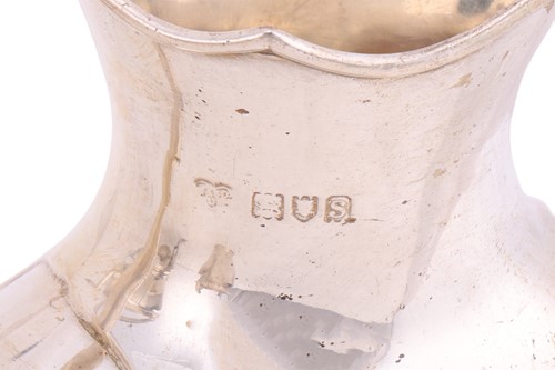 Lot A four piece silver tea service; comprising a...