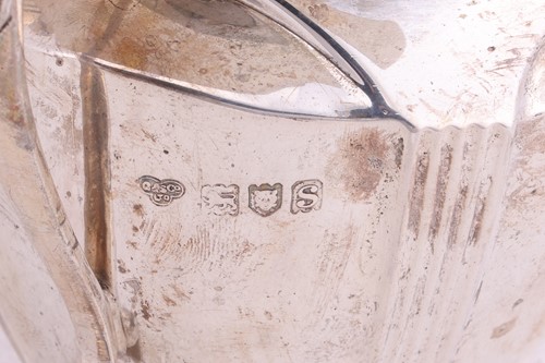Lot A four piece silver tea service; comprising a...