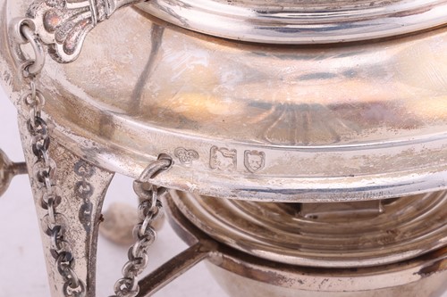 Lot A four piece silver tea service; comprising a...