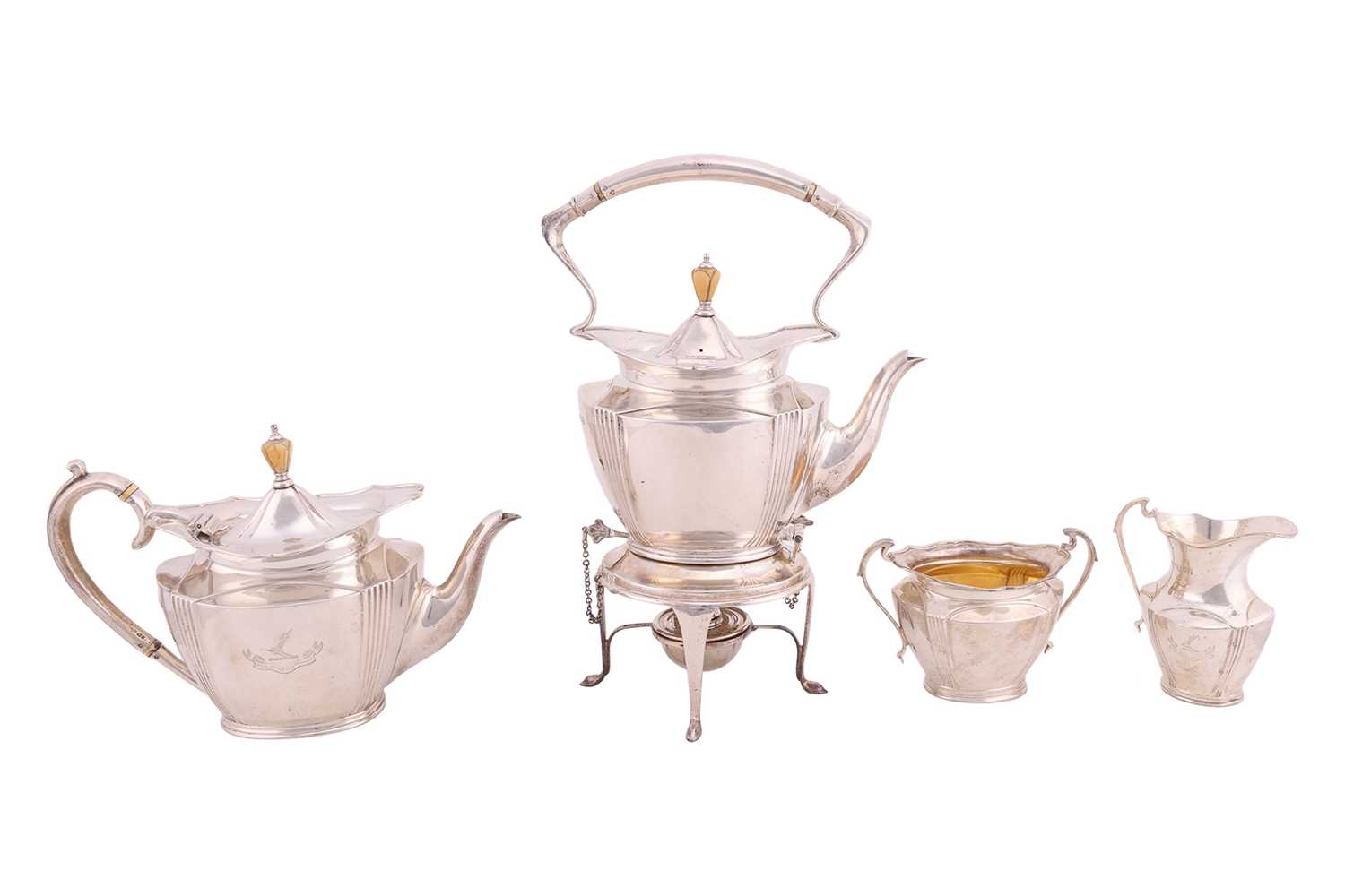 Lot A four piece silver tea service; comprising a...