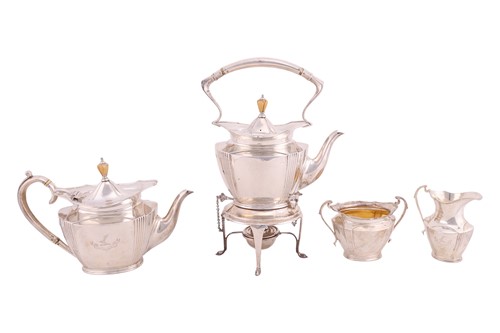 Lot A four piece silver tea service; comprising a...