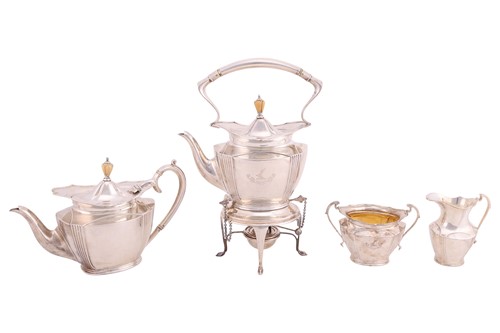 Lot A four piece silver tea service; comprising a...