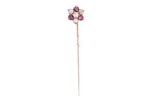 Lot 82 - A paste stick pin, designed as a flowerhead,...