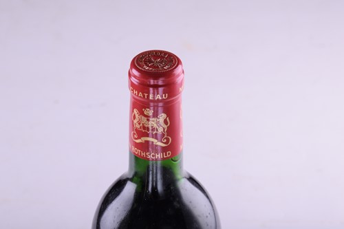 Lot Three bottles of 1986 Chateau Mouton...