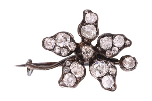 Lot 5 - An old-cut diamond flower brooch, sculpted as...