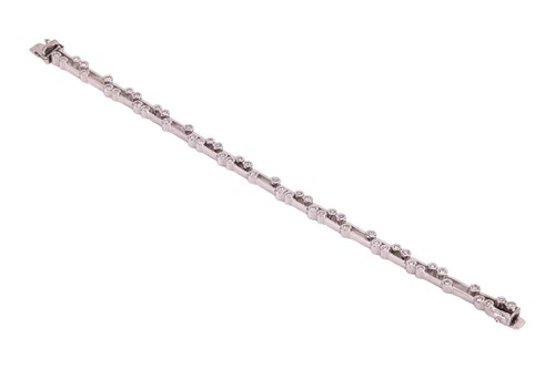 Lot 189 - A diamond-set bracelet, comprising two rows of...