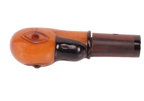 Lot 202 - A bakelite parasol handle, carved as a duck...