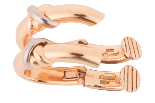 Lot 211 - Cartier - A trinity ring and clip earrings set;...