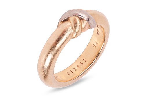 Lot 211 - Cartier - A trinity ring and clip earrings set;...