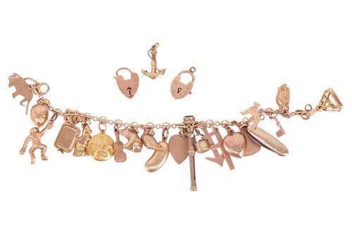 Lot 130 - A charm bracelet, to include a diamond-set...