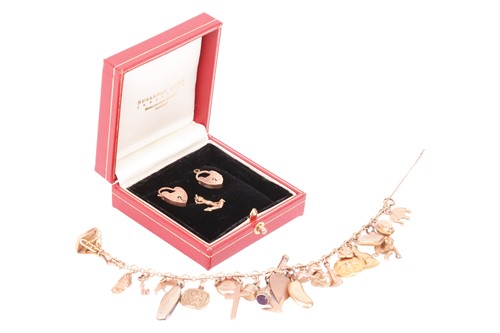 Lot 130 - A charm bracelet, to include a diamond-set...