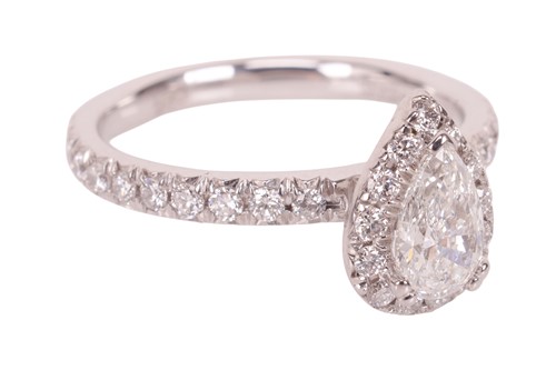 Lot 187 - A pear-cut diamond cluster ring, featuring a...