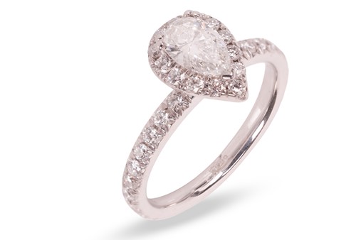 Lot 187 - A pear-cut diamond cluster ring, featuring a...