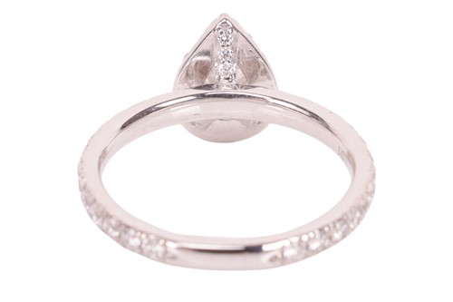 Lot 187 - A pear-cut diamond cluster ring, featuring a...