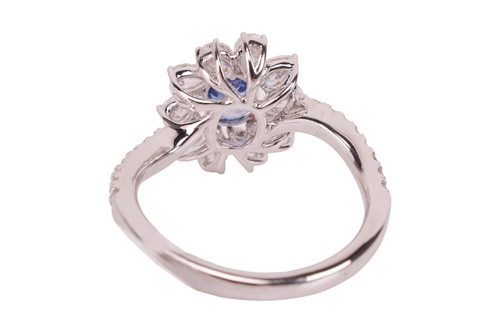 Lot 190 - A Kashmir sapphire and diamond cluster ring,...