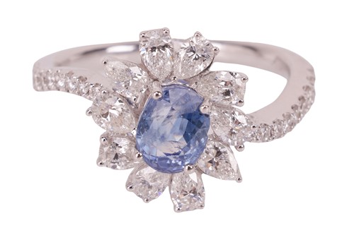 Lot 190 - A Kashmir sapphire and diamond cluster ring,...
