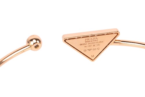 Lot 212 - Prada - An 'Eternal Gold' open bangle with...