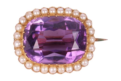 Lot 16 - An amethyst and seed pearl brooch, featuring a...