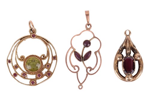 Lot 8 - Three gem-set pendants; The first a peridot...