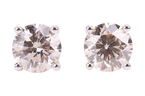 Lot 184 - A pair of round brilliant-cut diamond stud...
