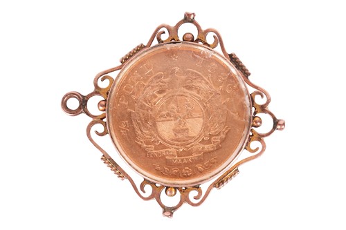 Lot 169 - A coin pendant, glazed compartment encased...