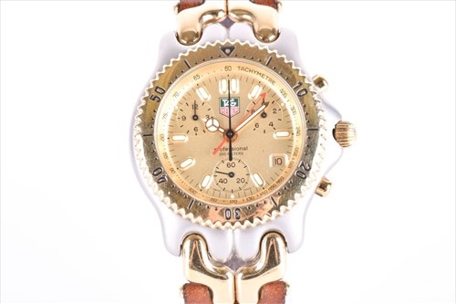 Lot 431 - A Tag Heuer two tone chronograph wristwatch...