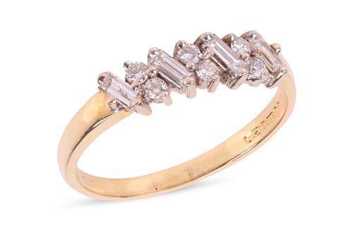 Lot 135 - A diamond-set dress ring, featuring claw-set...