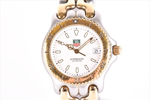 Lot 434 - A Tag Heuer two tone mid size wristwatch the...