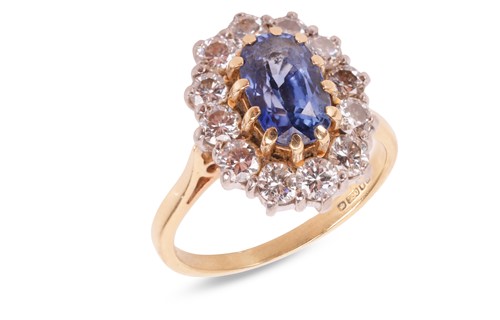 Lot A sapphire and diamond cluster ring in 18ct...