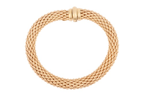 Lot 199 - A flexible tubular mesh bracelet, composed of...