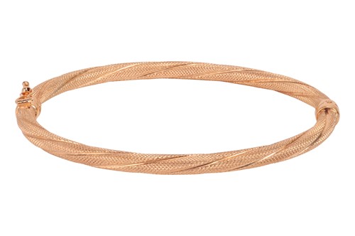 Lot 116 - A hinged bangle in 9ct rose gold, of twisted...