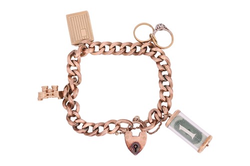 Lot 77 - A 9ct gold charm bracelet, the curb link chain...