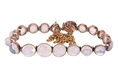 Lot 68 - A moonstone set line bracelet. The mix of...