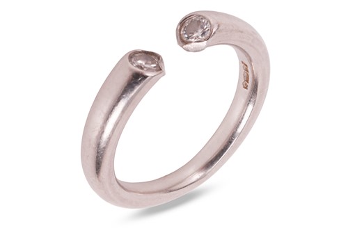 Lot A torque-style diamond-set ring, the platinum...