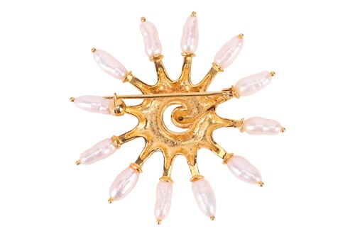 Lot A pearl set starburst brooch, the textured...