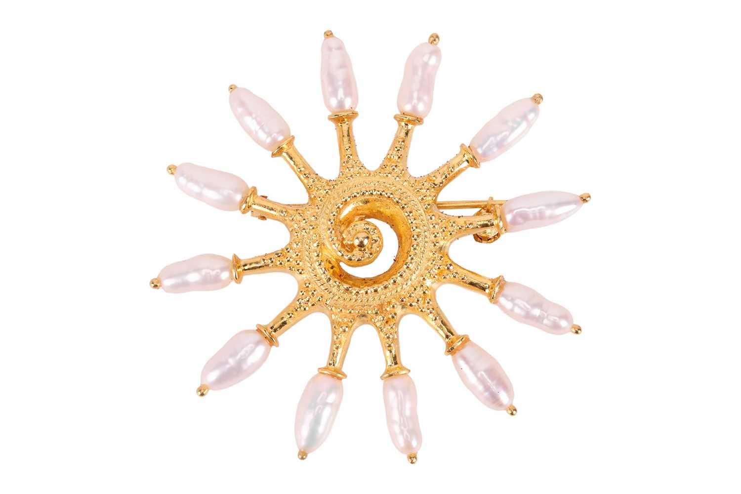 Lot A pearl set starburst brooch, the textured...