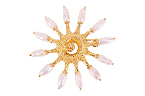 Lot A pearl set starburst brooch, the textured...