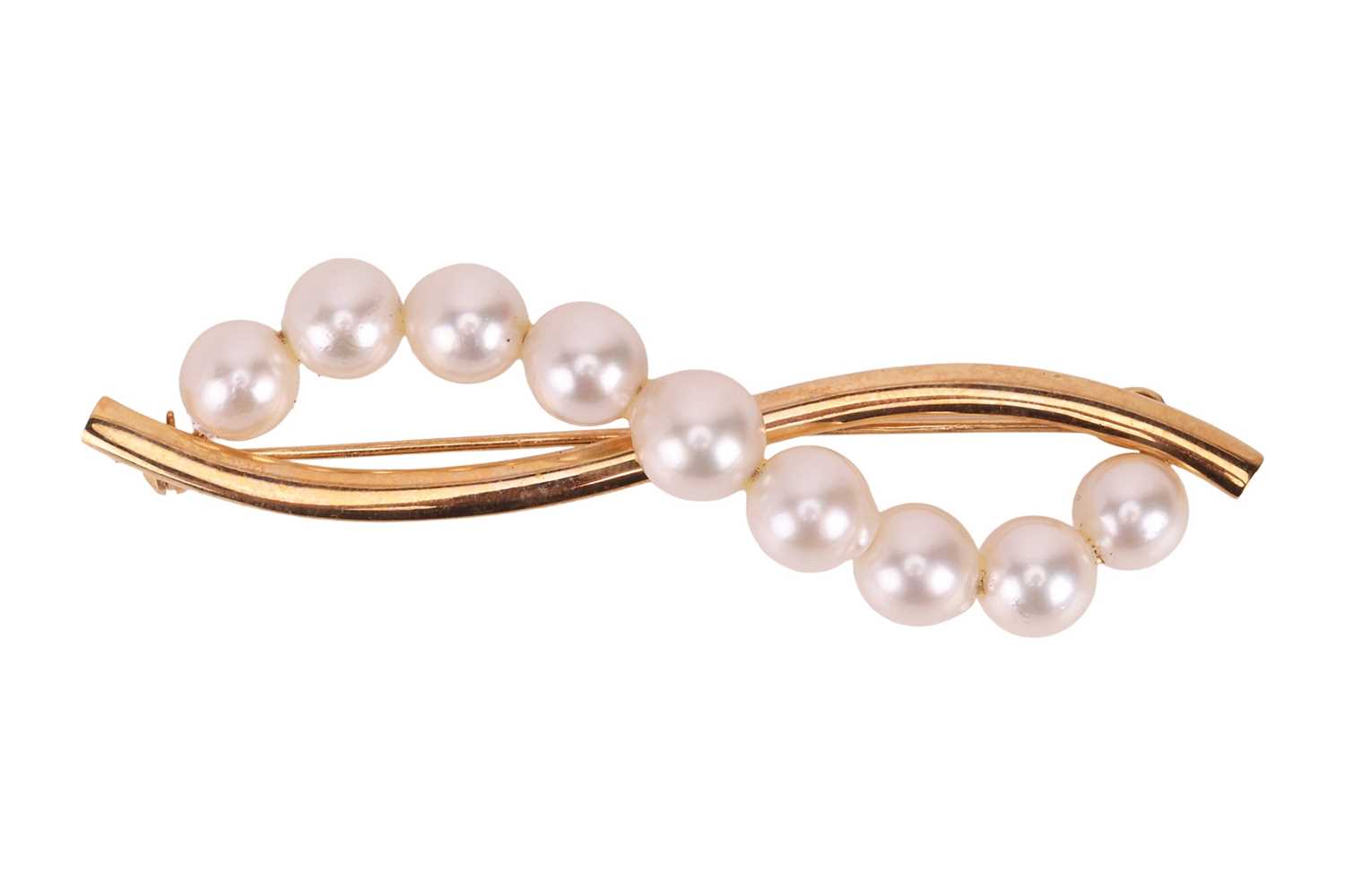 Lot A pearl set brooch, set with a scrolling row...