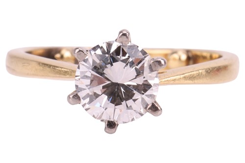 Lot A diamond solitaire ring, featuring a round...