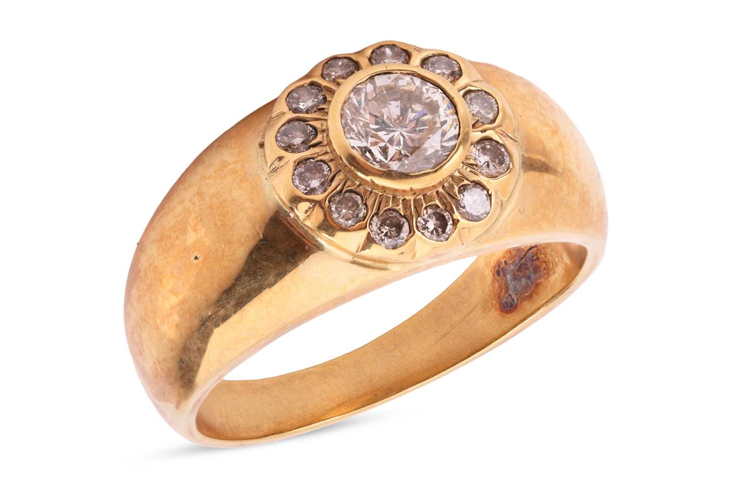 Lot A diamond single stone ring, the raised collet-...