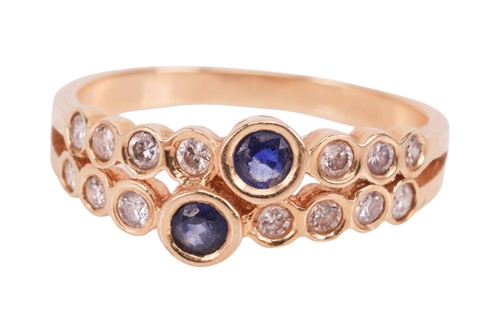 Lot A sapphire and diamond-set ring, the two...