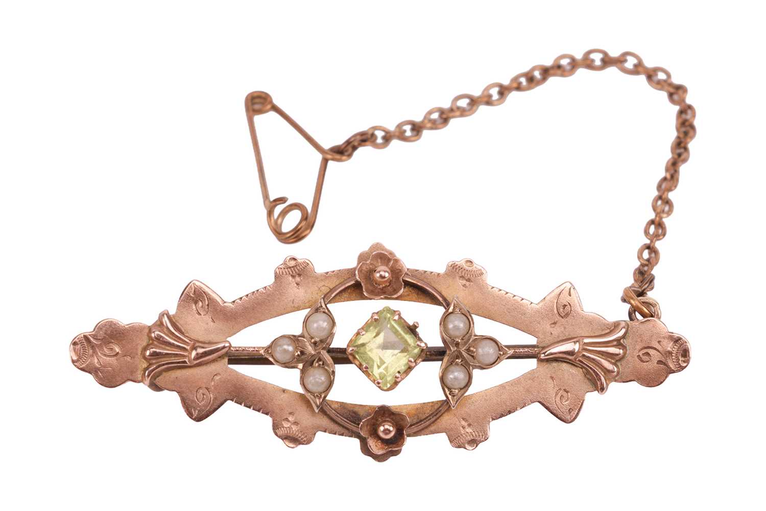 Lot An Edwardian peridot brooch, the openwork...
